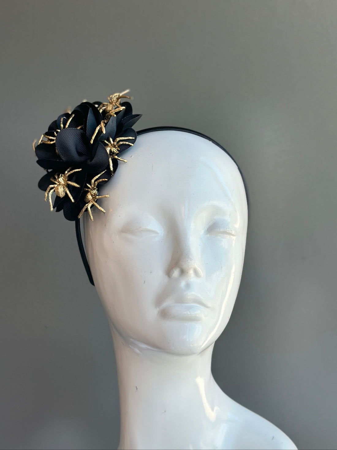 Black ribbon Halloween headband with gold glitter spiders for spooky costume or party looks