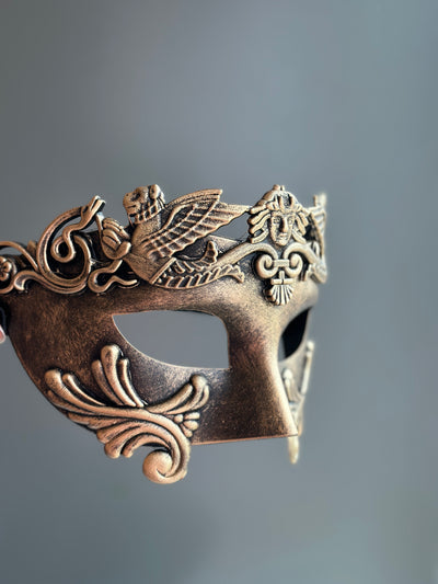 Men's antique-style masquerade mask in gold with classical detailing 