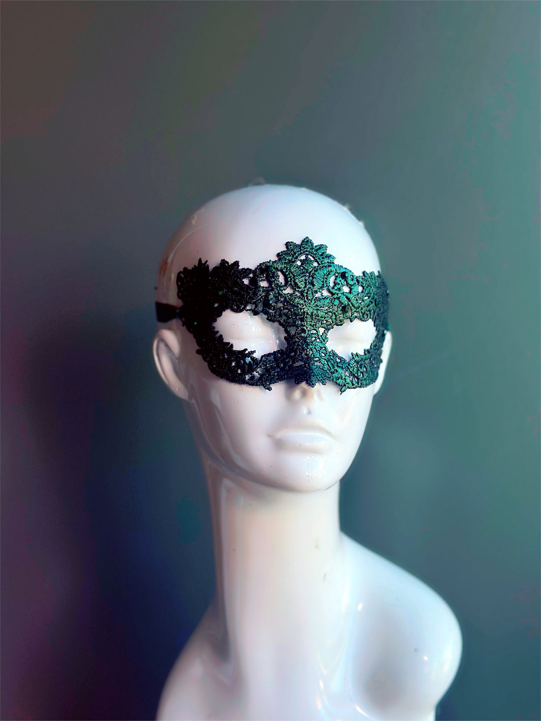 Green lace masquerade mask with floral cutout design, perfect for prom, masquerade ball, or Halloween party.