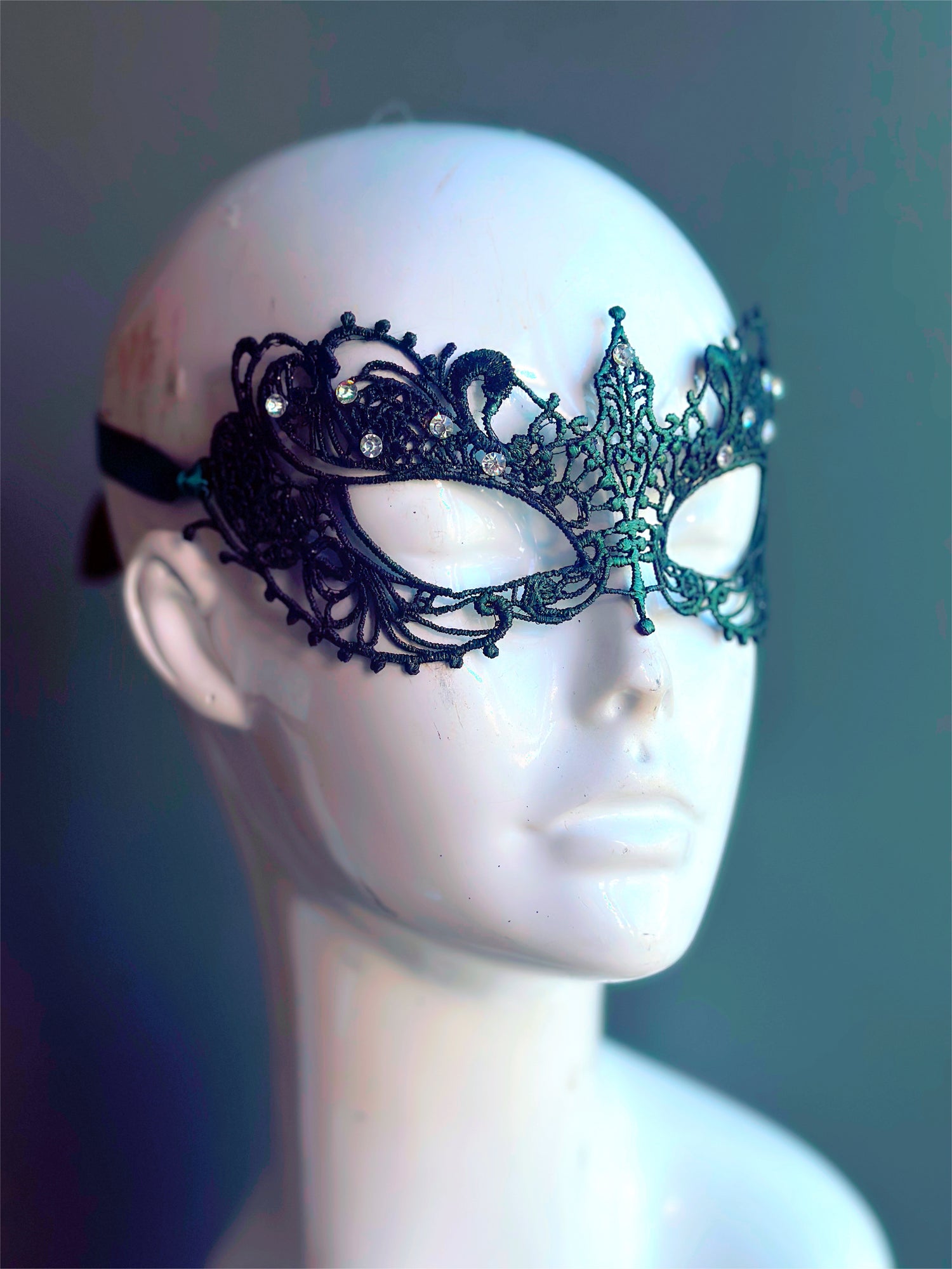 Green lace mask and inlaid with delicate rhinestones, perfect for any masked event! 