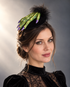 Green Spell Witch Hand Fascinator with realistic green witch hand, purple fingernails, black feathers, and Halloween styling.