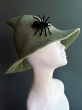 Sage green Halloween witch hat with spider detail on the brim