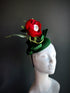 Halloween eyeball flower fascinator hat with red rose and creepy eyeball center, gothic headpiece for haunted parties and costumes.