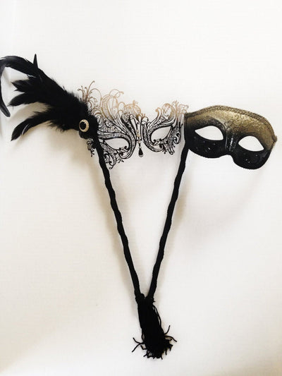 Elegant black and gold couples masquerade masks with feathered and glitter finishes for prom or themed parties


