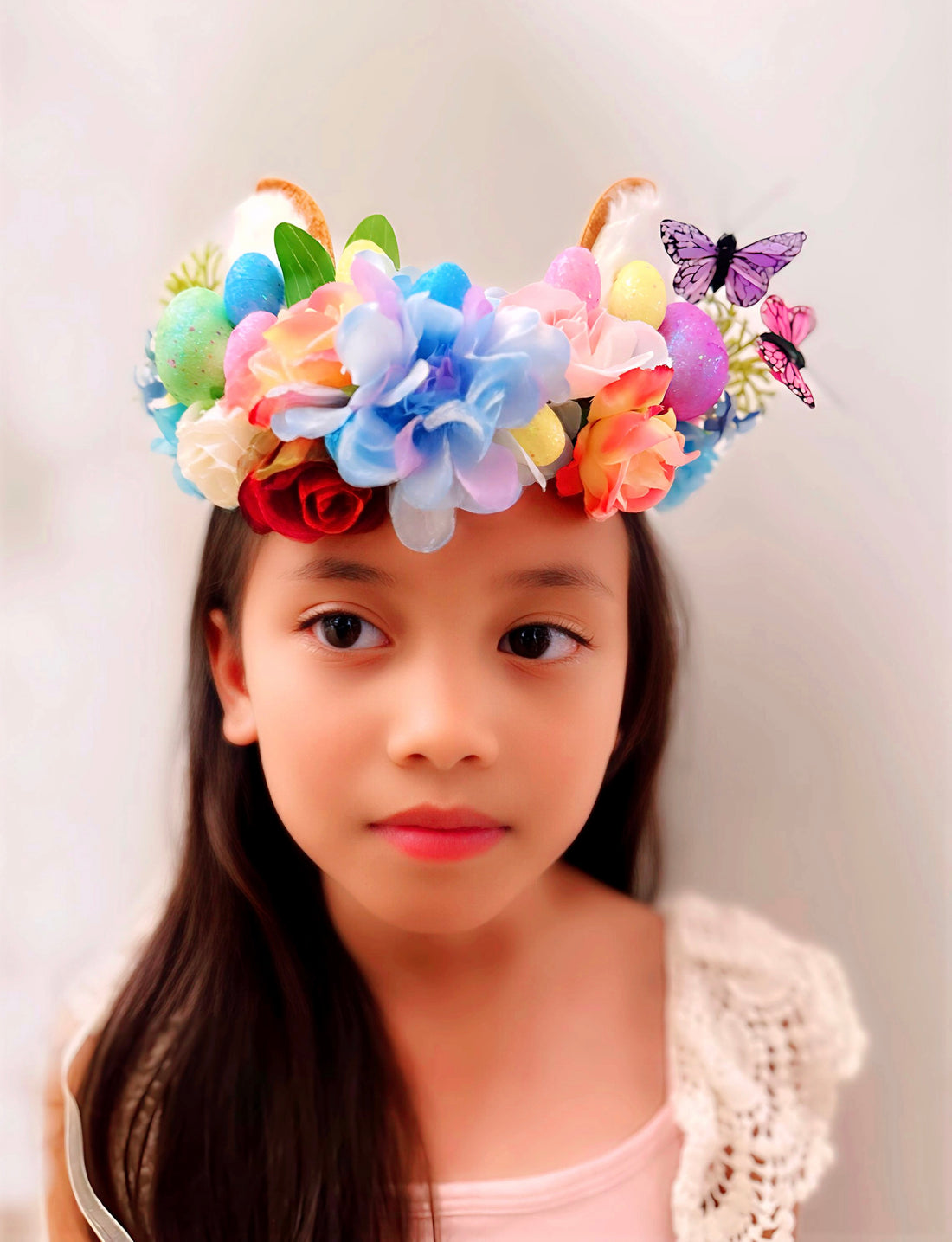 Kids flower crown with easter eggs and butterflies.