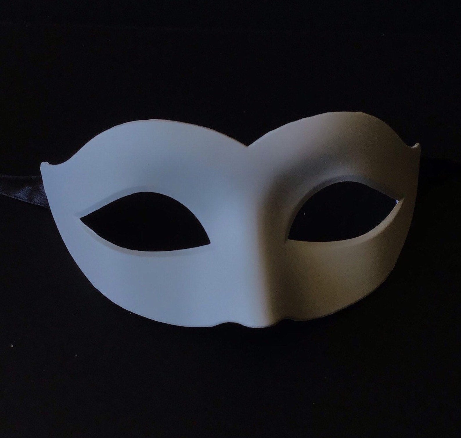 Unpainted white kids mask.