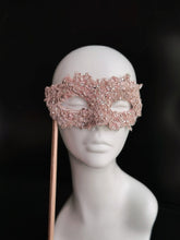 Light pink lace masquerade mask with rhinestones for party and wedding events.