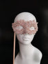 Light pink lace masquerade mask with rhinestones for party and wedding events.