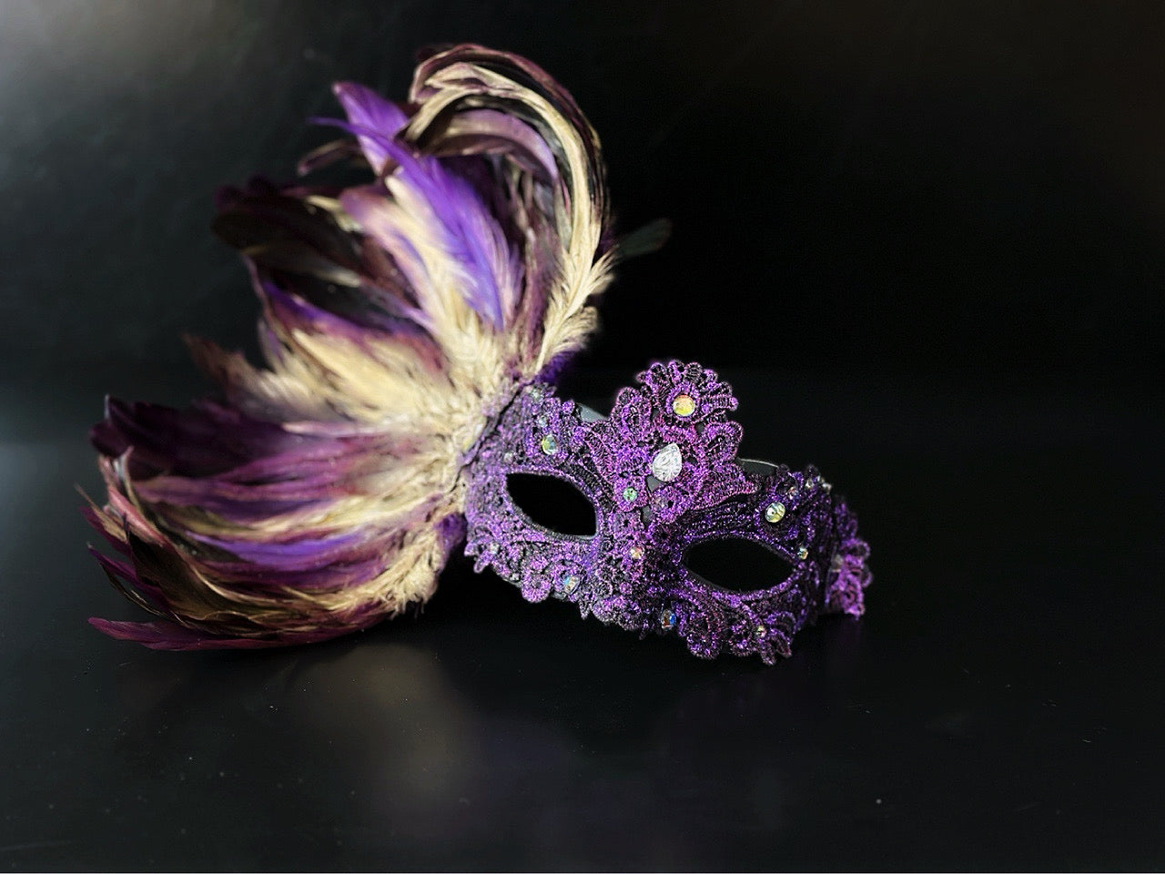 Purple feather masquerade women mask  with ornate resin half mask for formal costume occasions.