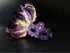 Purple feather masquerade women mask  with ornate resin half mask for formal costume occasions.