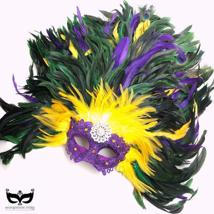 Colorful Mardi Gras feather mask in traditional carnival colors with dramatic plumes and sparkling details