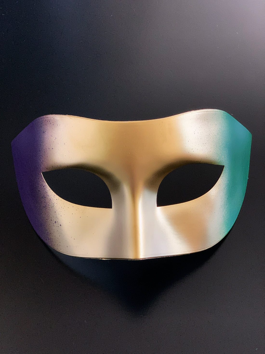 Gold, blue, and purple Mardi Gras masquerade mask in bauta style.