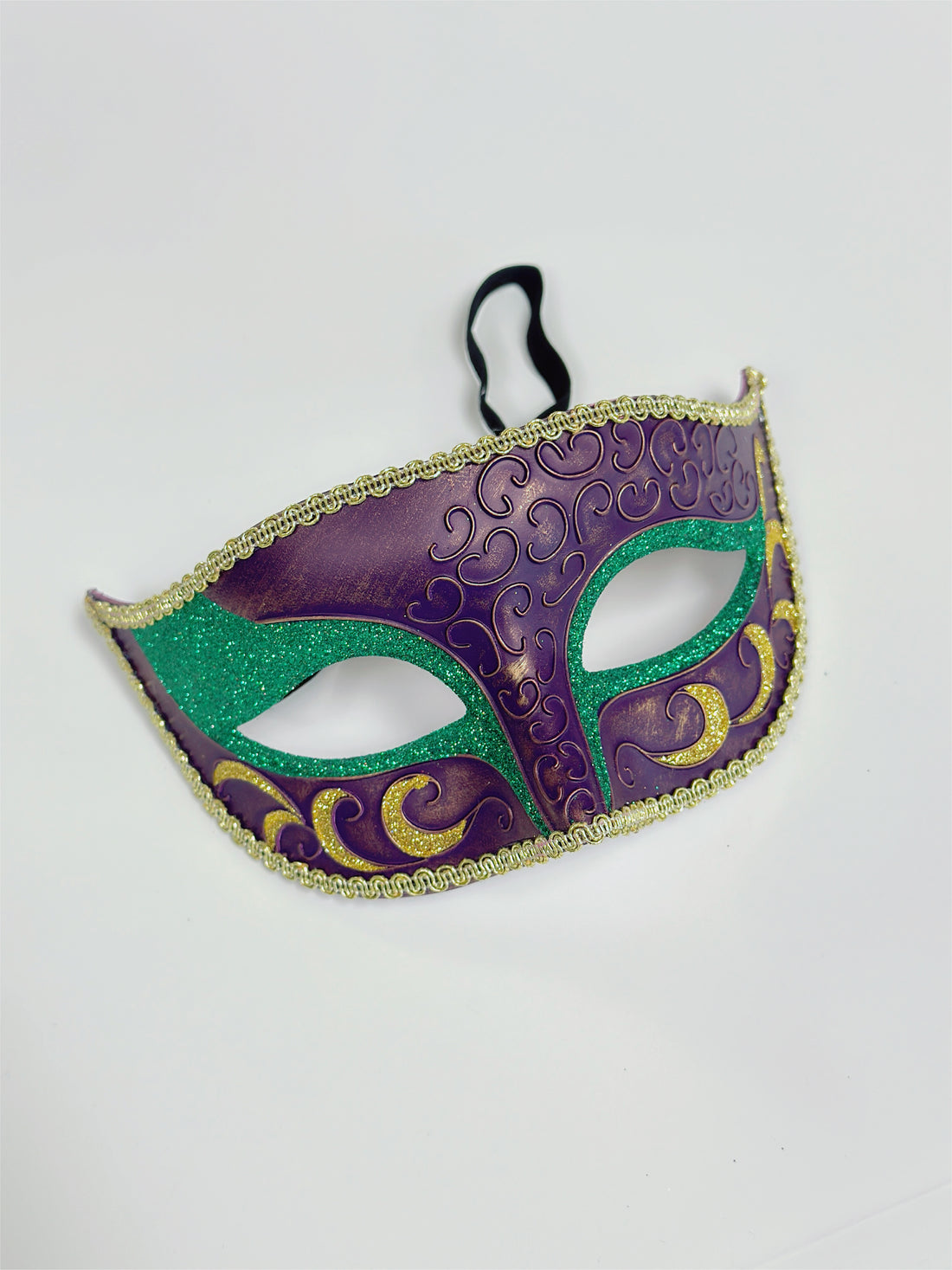 Festive Mardi Gras masquerade mask in purple, green, and gold glitter, perfect for carnival parades, balls, and masquerade parties.