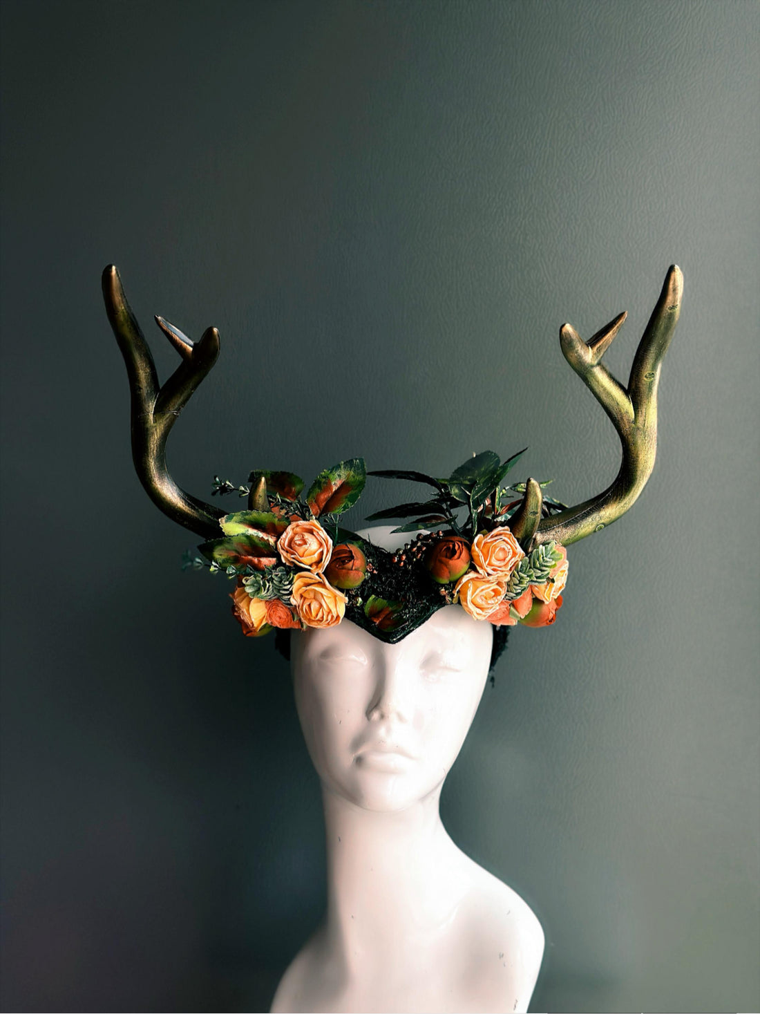 Fantasy crown headpiece with antlers and orange rose floral details, ideal for masquerade balls, forest queen looks, or fall festivals.