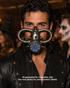 Distressed silver Ironveil steampunk gas mask with circular respirator grille, large coiled tube loops, pointed spikes, and pale blue-gray filter panels.