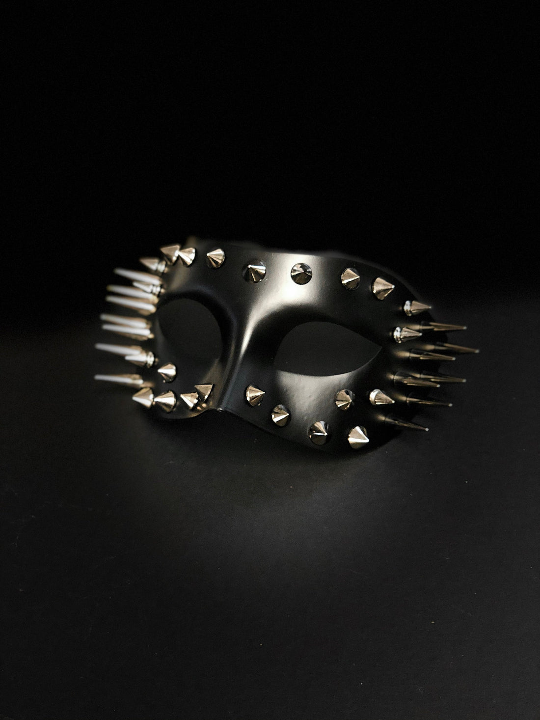 Mens masquerade mask in black with metal silver spikes for sale.
