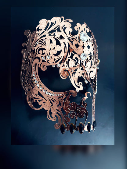 Mens metal skull masquerade mask in rose gold.
