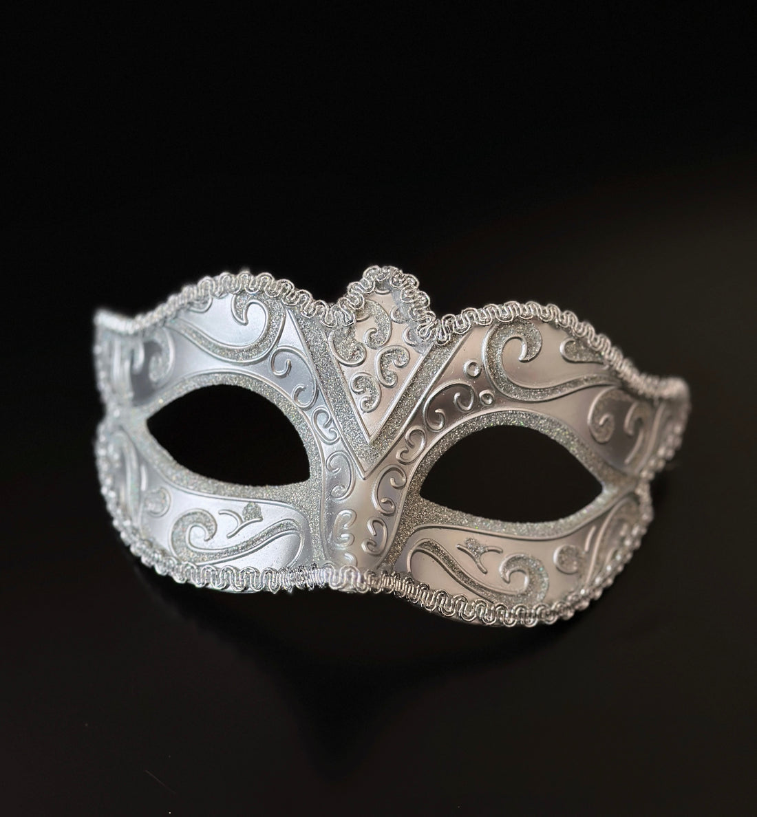 Nocturn silver venetian masquerade mask with raised scroll design for elegant formal events.