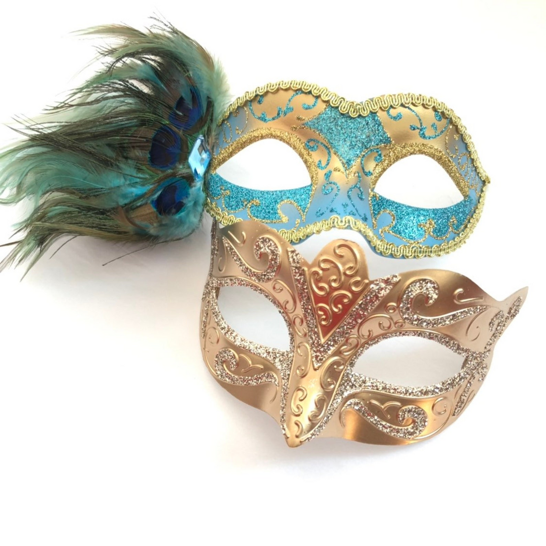 Couple’s masquerade mask set with a turquoise peacock feather mask and a gold glitter filigree mask for Venetian-style events.