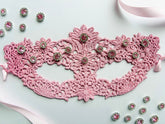 Pink lace masquerade mask with blush crystal rhinestones for moon ball and gala evening events.