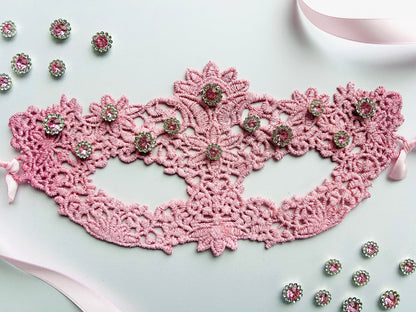 Pink lace masquerade mask with blush crystal rhinestones for moon ball and gala evening events.