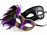 Purple and gold couples masquerade mask set with men’s blue eye mask and women’s peacock feather Venetian mask for formal masquerade styling.