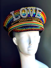 Rainbow rhinestone captain hat with LOVE statement letters, designed for Pride, drag, and festival costumes