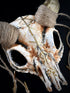 Halloween costume mask with ram skull design, golden runes, and twine horns