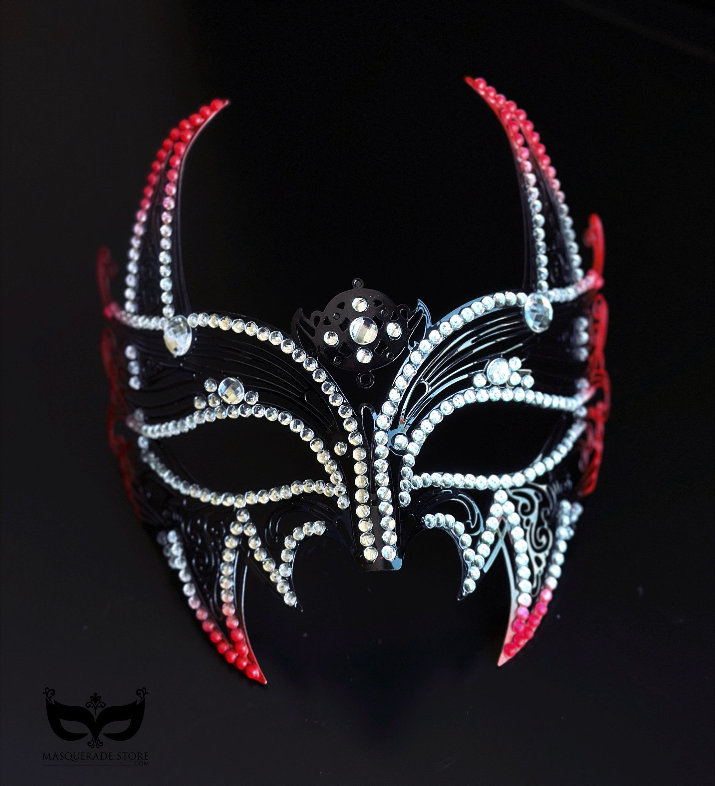 Red and black horned masquerade mask with rhinestone accents, curved horn points, ribbon ties, and gothic Venetian-inspired styling for formal events.