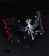 Red and black spiderweb masquerade mask with gothic openwork filigree, rhinestone accents, red web edges, and ribbon ties for costume events.