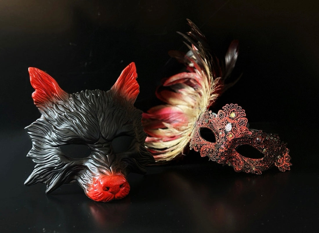 Red and black couple masquerade mask set with wolf mask and feather lace mask for masquerade and costume events.