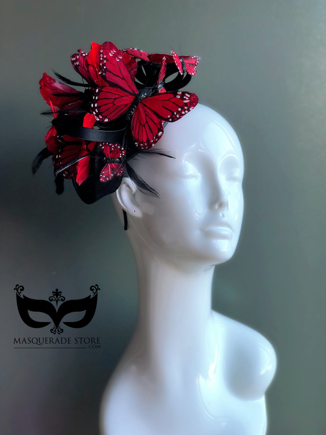Red butterfly fascinator hat with layered butterflies and feathers for gothic masquerade or Halloween look.