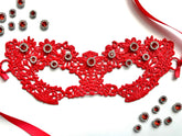 Red floral lace masquerade mask with crimson rhinestones for gothic gala and Venetian ballroom events.