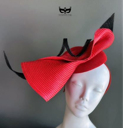 Red bow fascinator hat with black accents for derby events, weddings, and race day styling.