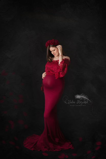 Deep red floral maternity crown styled for a photoshoot with matching dress