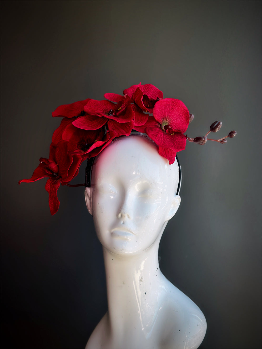 Bold red orchid fascinator hat floral headpiece for weddings and Kentucky Derby.