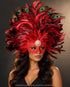 Large red feather Venetian masquerade mask featuring layered crimson and burgundy plumes, peacock eye feathers, decorative red scrollwork, and a gold floral centerpiece.
