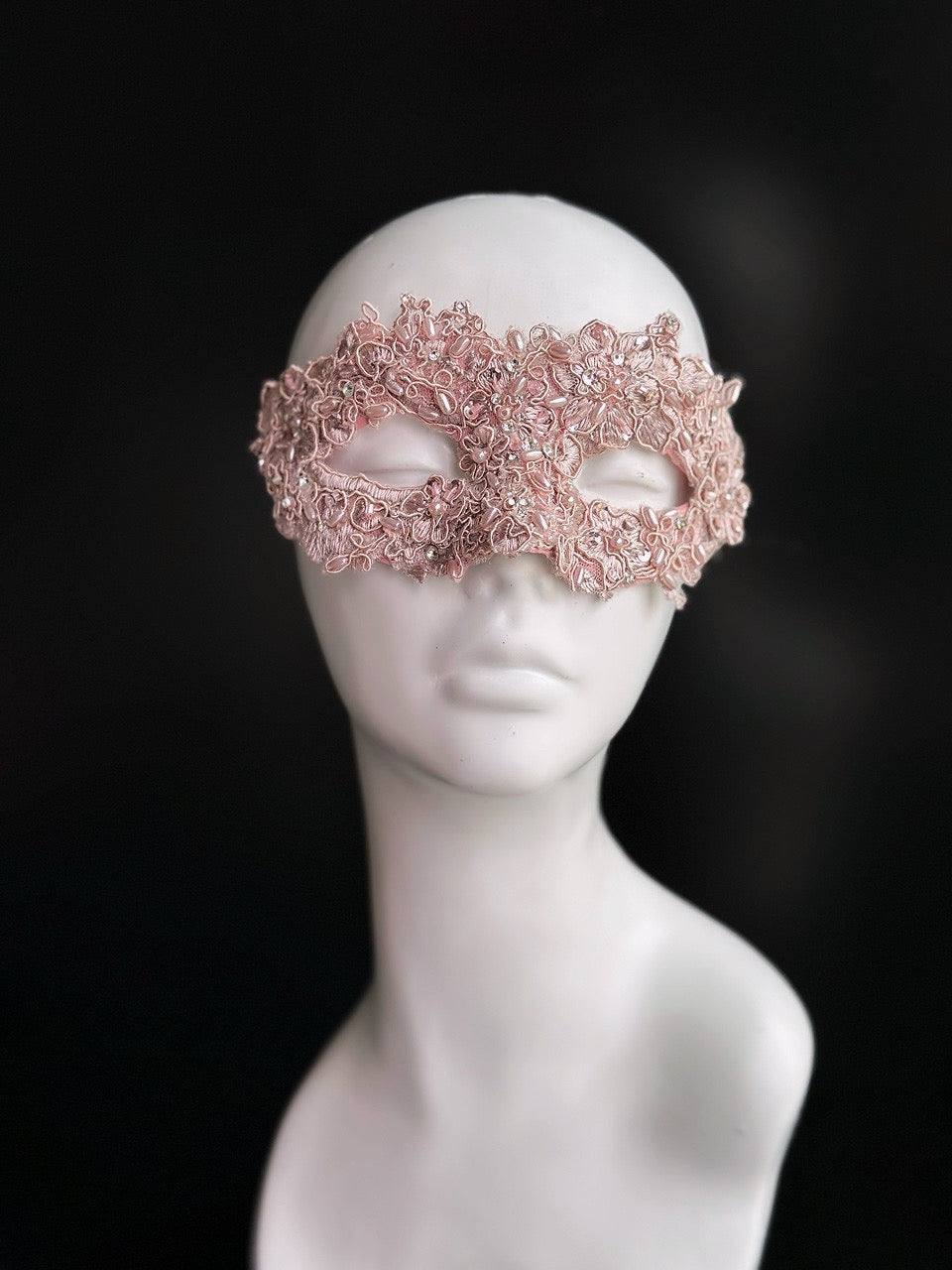 Rose gold and pink lace masquerade mask with rhinestones for party and wedding events.