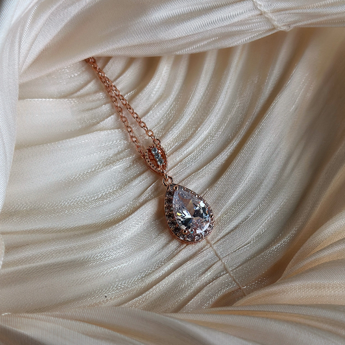 Crystal teardrop necklace in rose gold, perfect for weddings or formal occasions