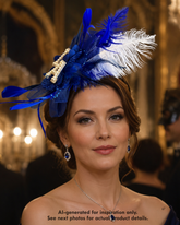 Royal blue LA fascinator with layered feathers, floral accents, blue tulle, pearl rhinestone letter details, and statement game-day styling.