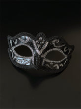 Black Venetian masquerade mask with silver glitter scroll design for elegant formal events.