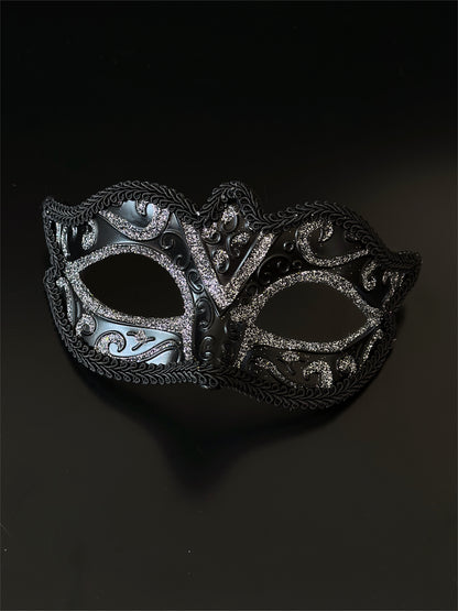 Black Venetian masquerade mask with silver glitter scroll design for elegant formal events.