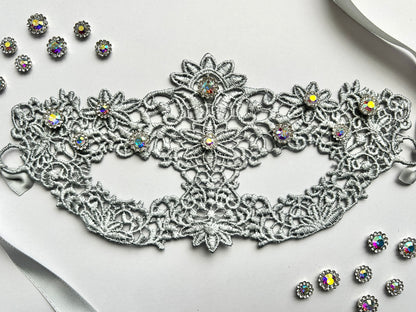 Silver floral lace masquerade mask with aurora rhinestones for moon ball and Venetian gala events.