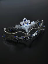 Silver masquerade mask with ornate filigree, rhinestones, and sapphire blue gems, perfect for women at Venetian masquerade balls, Mardi Gras, and parties.