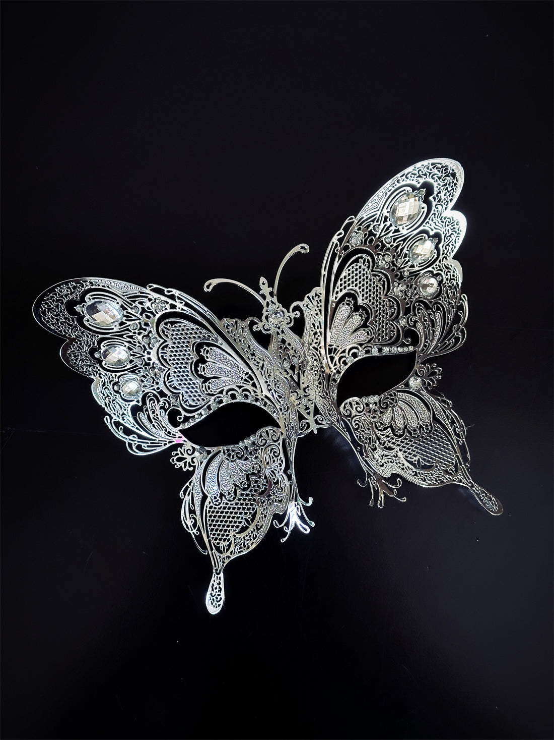  Intricate silver metal masquerade mask shaped like a butterfly for fantasy events
