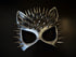 Metallic silver cat ear masquerade mask with bold black ombré and dramatic silver spikes, styled for edgy party or Halloween looks.