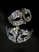 Elegant silver filigree couples masquerade masks with intricate cutout designs, perfect for Venetian balls, weddings, and formal themed events.
