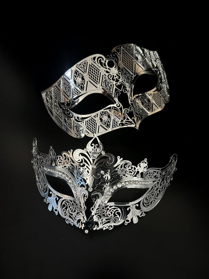 Elegant silver filigree couples masquerade masks with intricate cutout designs, perfect for Venetian balls, weddings, and formal themed events.