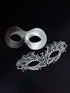 Elegant silver couples masquerade masks featuring a sleek metallic men’s mask and a delicate lace women’s mask, perfect for Venetian balls, weddings, and formal celebrations.