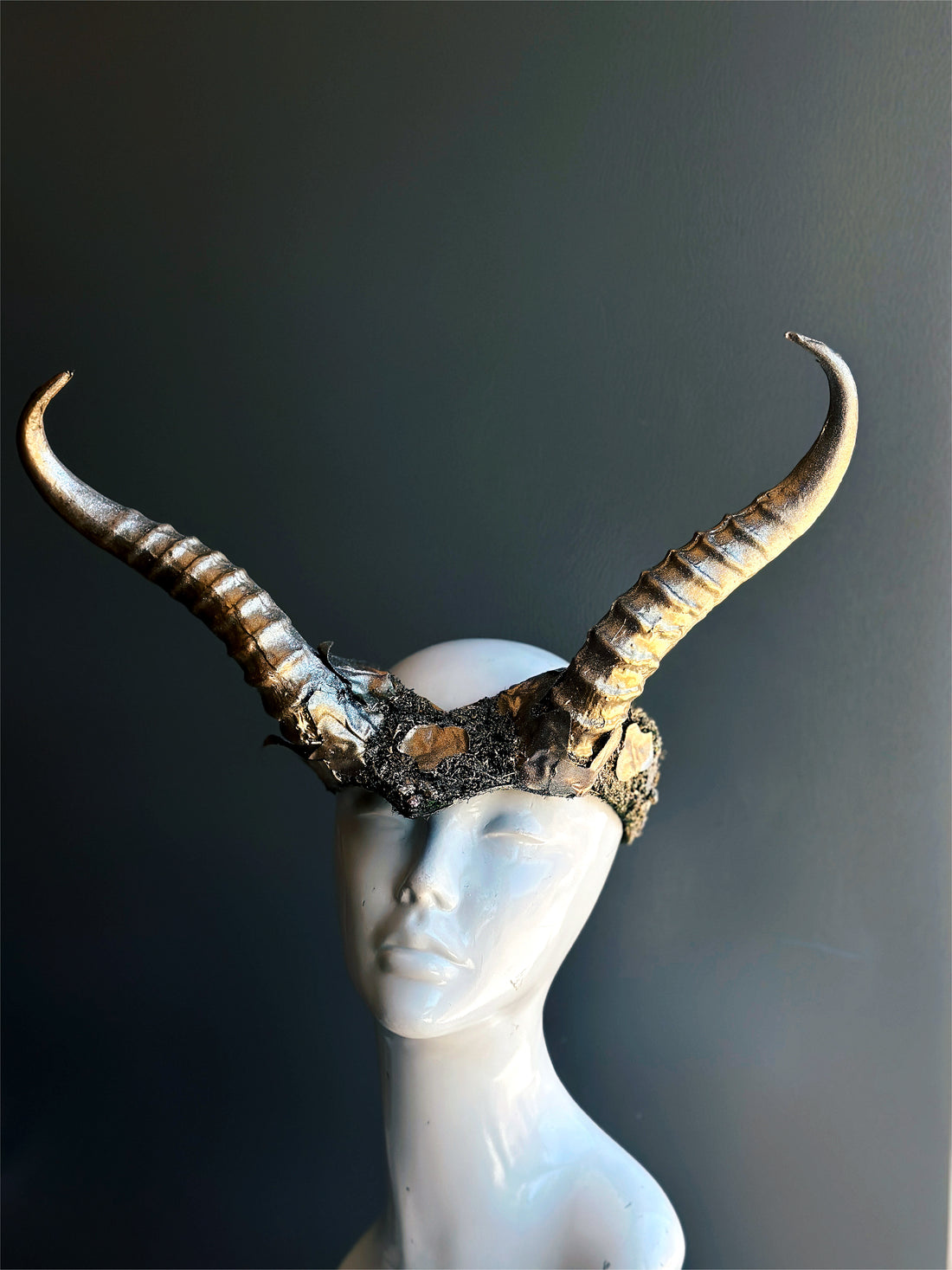 Silver ram horn headdress with sculpted details, designed for cosplay, masquerade, and fantasy costumes